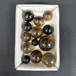 Smoky Quartz Spheres shown for scale and natural variation