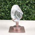 Side view of Lemurian Quartz Display Piece - Faceted Lemurian with Spinning Stand showing natural crystal details