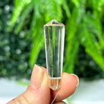 Clear Quartz Mini Vogel - Drilled for Jewelry shown for scale and natural variation