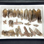 Close-up of 100% Natural Smoky Garden Quartz Lot with visible color and formation