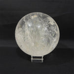 Side view of Lemurian Quartz Sphere showing natural crystal details