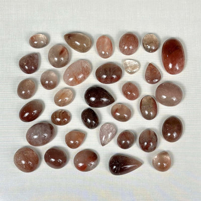 Rutile Quartz Cabochon - Red Rutile Cabochons Lot from Amezoni Crystals, front view