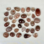 Rutile Quartz Cabochon - Red Rutile Cabochons Lot from Amezoni Crystals, front view