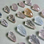 Side view of Rose Quartz Teardrop Briolette - Drilled for Jewelry showing natural crystal details
