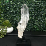 Side view of Diamantina Quartz Cluster - Semi Polished Laser Cluster with Stand showing natural crystal details