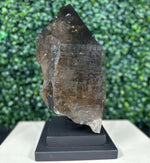 Side view of Diamantina Quartz Point - 100% Natural Smoky Point with Stand showing natural crystal details