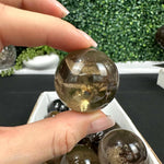 Side view of Smoky Quartz Spheres showing natural crystal details