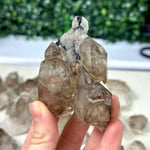 Close-up of Raw Elestial Smoky Quartz Lot Raw Crystal with visible color and formation