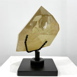 Close-up of Natural Citrine Free Form With Stand with visible color and formation