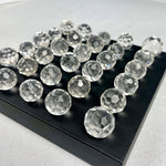 Close-up of Clear Quartz Briolette Lot with visible color and formation