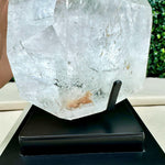 Close-up of Diamantina Inclusion Quartz Polished Point with Stand with visible color and formation