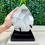 Side view of Diamantina Inclusion Quartz Polished Point with Stand showing natural crystal details