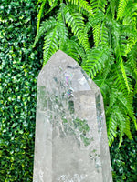 Close-up of Lemurian Quartz Point with Stand with visible color and formation