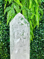 Close-up of Lemurian Quartz Point with Stand with visible color and formation