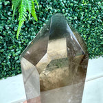 Close-up of Smoky Phantom Garden Quartz Point with Spinning Stand with visible color and formation