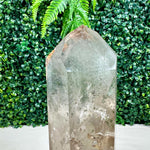 Side view of Garden Smoky Quartz DT point with stand showing natural crystal details