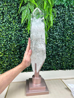 Side view of Polished High Quality Lemurian Quartz Point with Stand showing natural crystal details