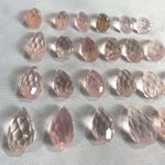 Side view of Rose Quartz Faceted Briolette Teardrop - undrilled showing natural crystal details
