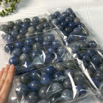 Blue Quartz Mini Spheres shown for scale and natural variation