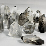 Side view of Lemurian Quartz Free Form - Black Phantom Lemurian Towers and Free Form Lot showing natural crystal details