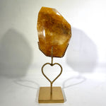 Golden Healer Free Form With Stand shown for scale and natural variation