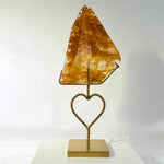 Side view of High Quality Golden Healer Free Form With Stand showing natural crystal details