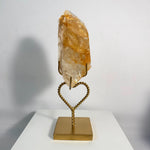 Side view of High Quality Golden Healer Free Form With Stand showing natural crystal details