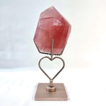Side view of High Quality Rose Quartz Free Form With Stand showing natural crystal details