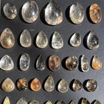 Close-up of Rutile Quartz Cabochon - High Quality Rutilated Cabochons Lot with visible color and formation