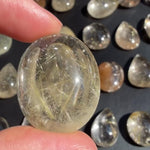 High Quality Rutilated Cabochons Lot product video showing Rutile Quartz Cabochon - High Quality Rutilated Cabochons Lot in bulk from Amezoni.