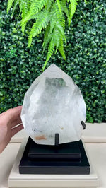 DIAMANTINA INCLUSION QUARTZ POLISHED POINT W/ STAND product video showing Shop Diamantina Inclusion Quartz Polished Point with Stand from Amezoni in Brazil.