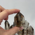 EXTRA SMOKY QUARTZ TOWER - 1kg Lot product video showing Brazilian Extra Smoky Quartz Tower - 1kg Lot wholesale.