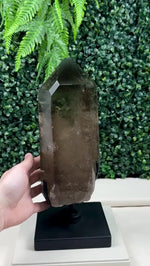 SMOKY PHANTOM GARDEN QUARTZ POINT W/ SPINNING STAND product video showing Shop Smoky Phantom Garden Quartz Point with Spinning Stand from Amezoni in Brazil., view 6.