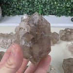 RAW ELESTIAL SMOKY QUARTZ LOT product video showing Brazilian Raw Elestial Smoky Quartz Lot Raw Crystal wholesale.