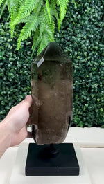 SMOKY PHANTOM GARDEN QUARTZ POINT W/ SPINNING STAND product video showing Shop Smoky Phantom Garden Quartz Point with Spinning Stand from Amezoni in Brazil., view 5.